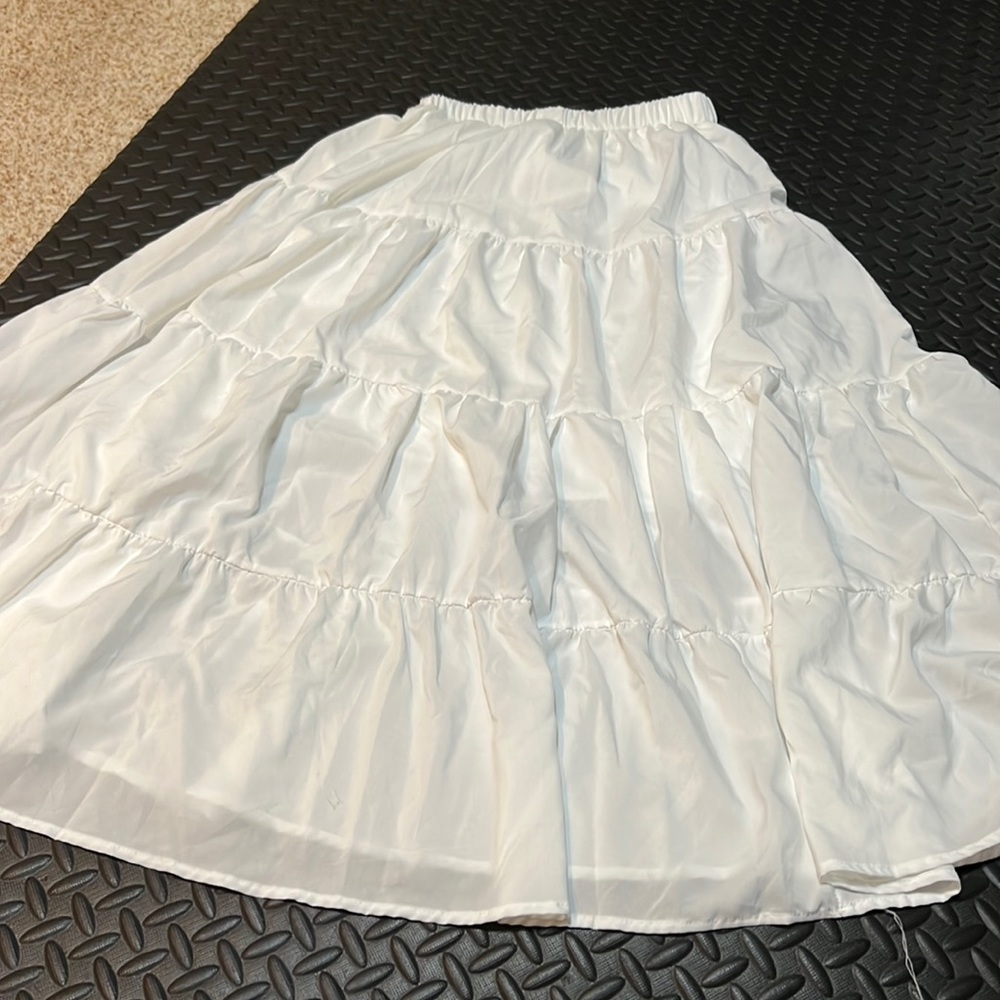 What is the white fluffy skirt with liner